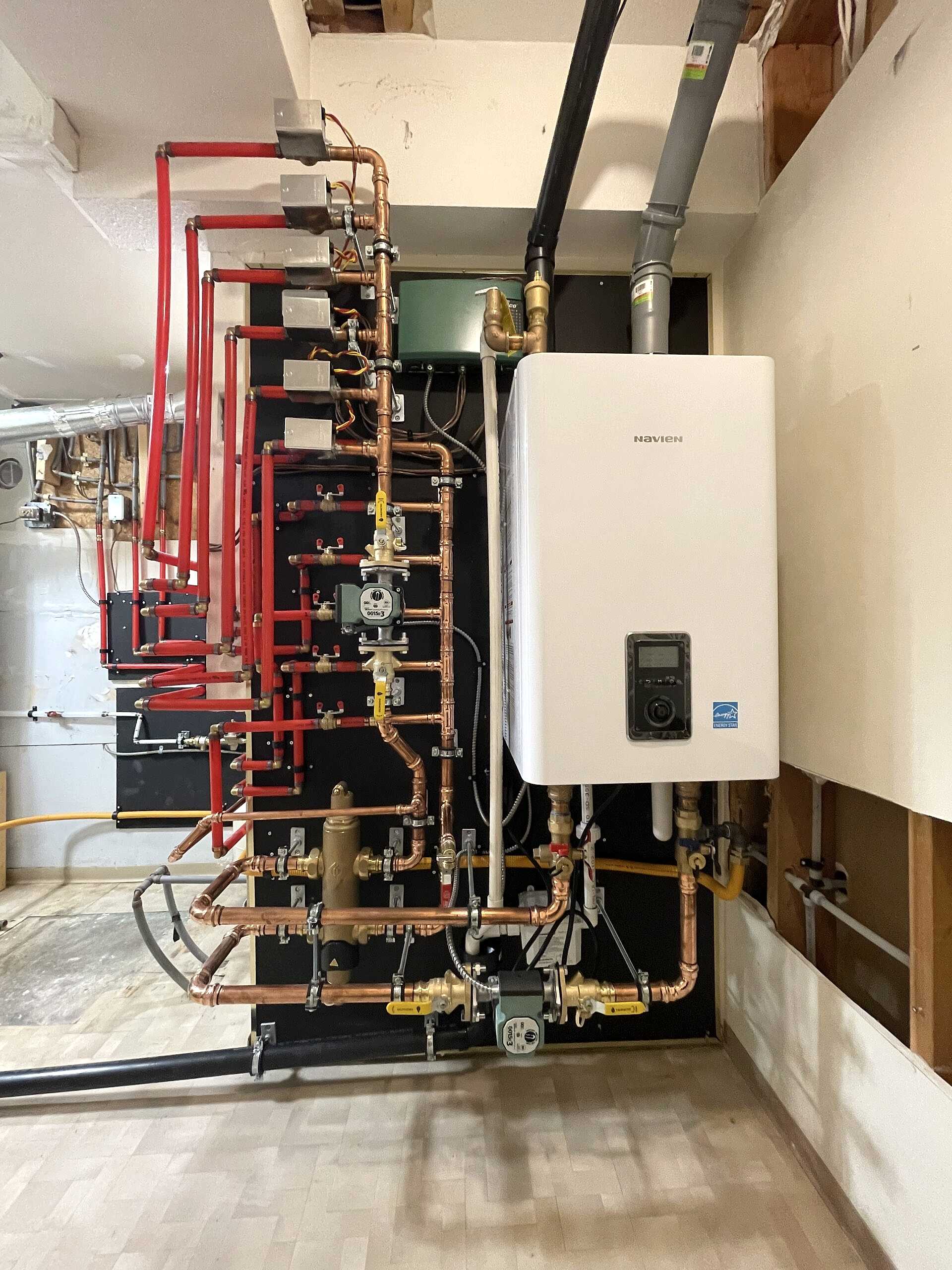 Hot water heater installation for hydronic radiant floor heating in Vancouver